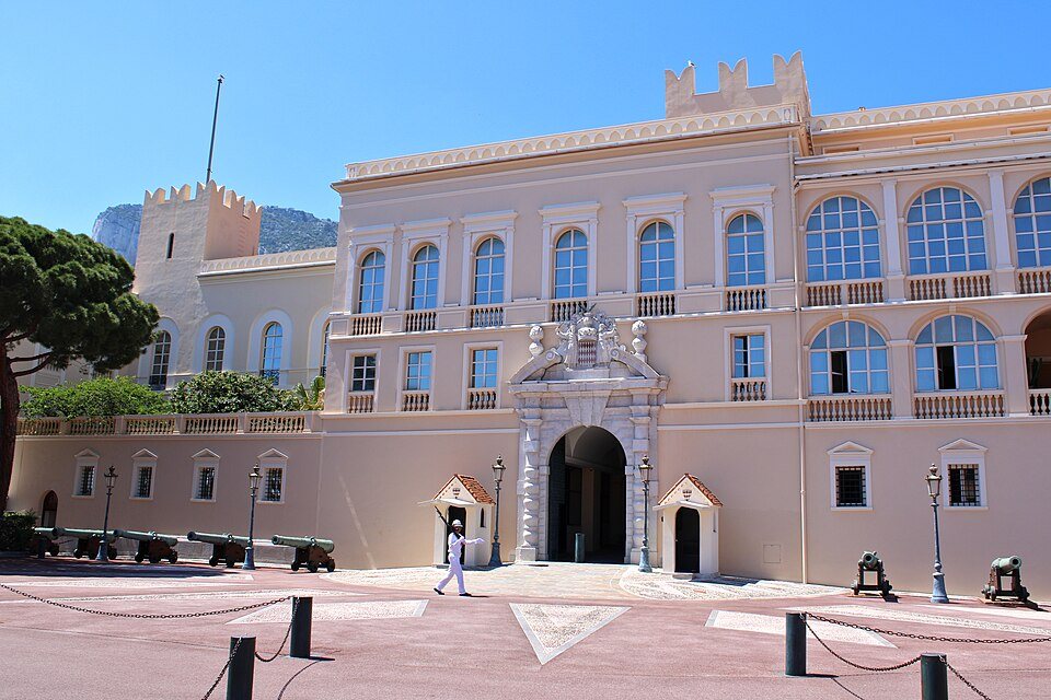 The Prince's Palace on the rock, a guard at the gate and the old cannons along the front